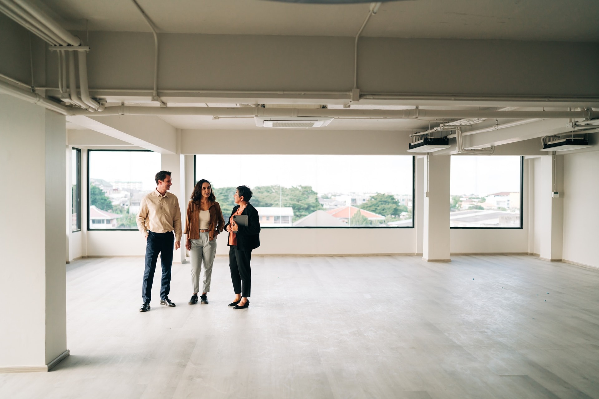 Business owners inspecting the vacant floor of their newly acquired premises, North Geelong VIC