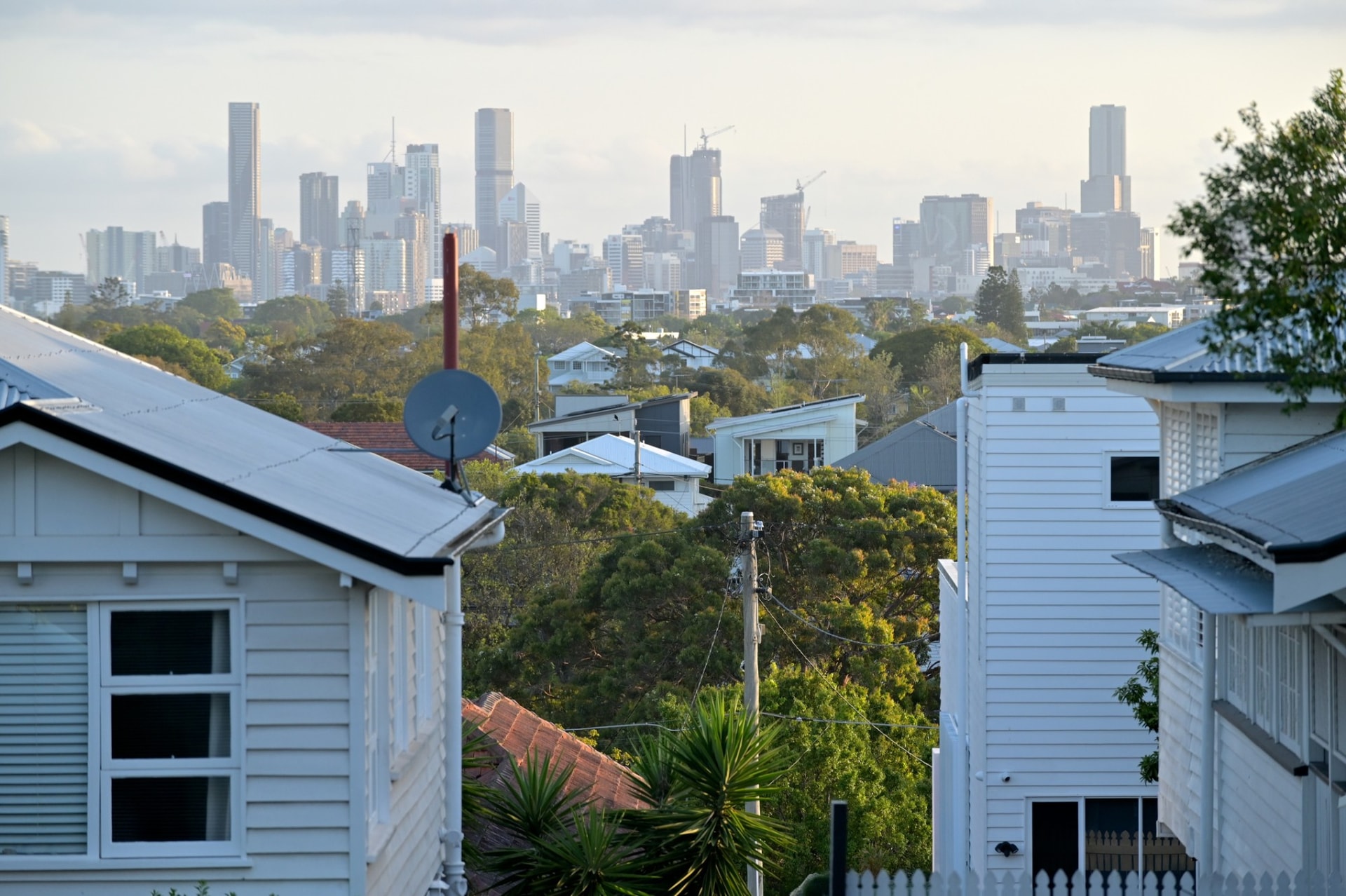 Queenslander homes with the Brisbane skyline behind, New Farm QLD