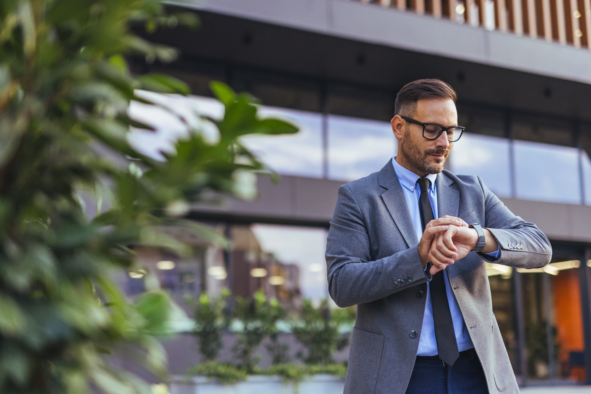 Businessman checking his watch ahead of an urgent property settlement
